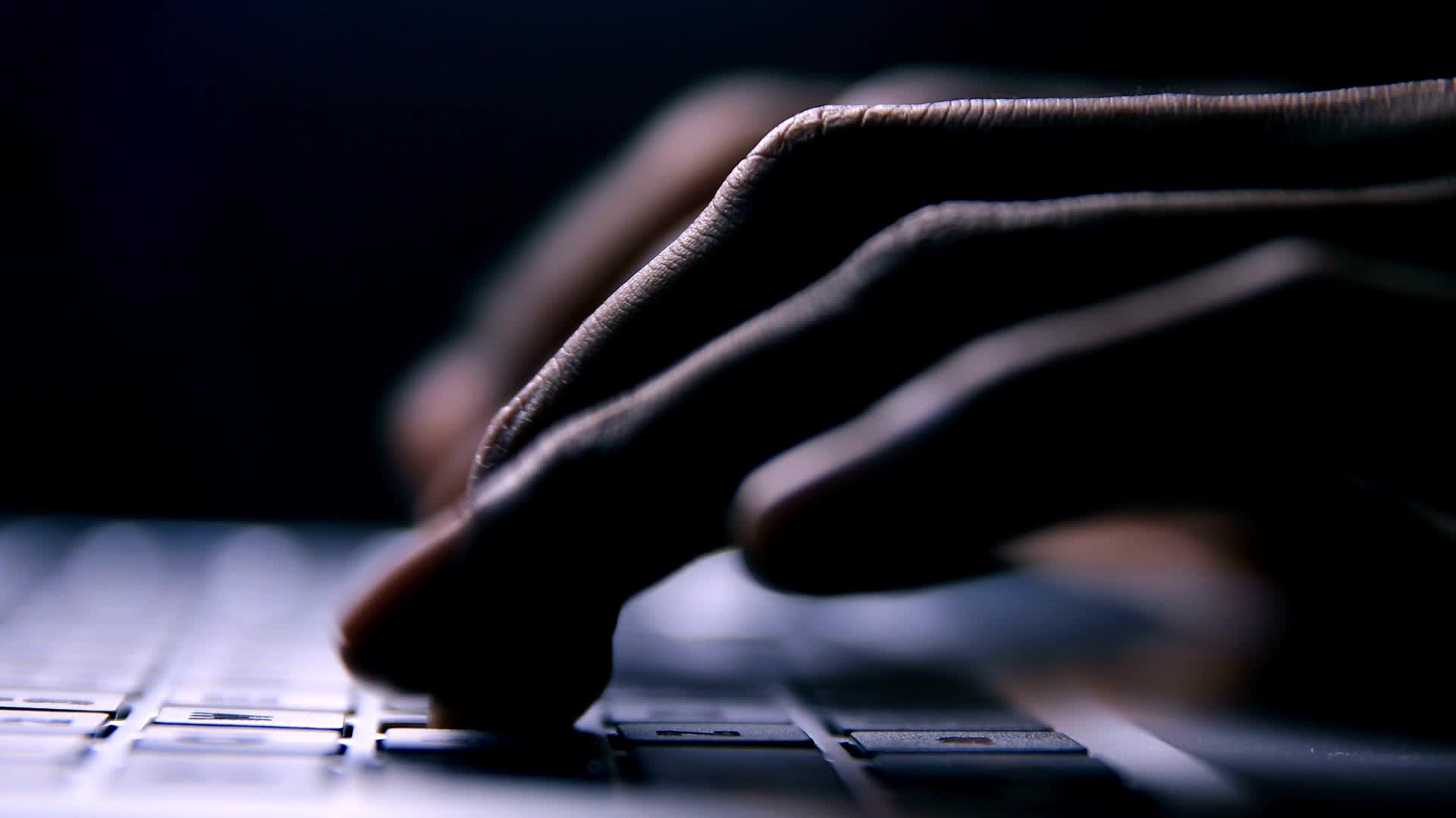 Hands typing feedback on laptop